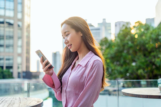 istock Asian Woman Using Smartphone In The City 2178010526