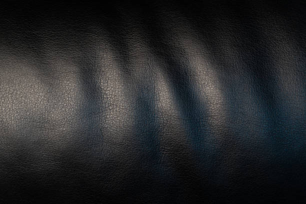 A close-up of wavy, smooth-finished faux leather. This material emphasizes modernity and practicality while remaining stylish.