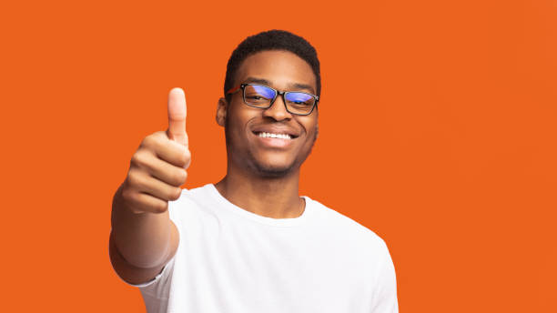 istock African american guy showing thumb up and smiling 2178013263