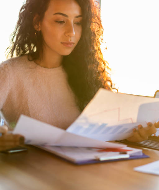 istock businesswoman examining graphs 2178014214