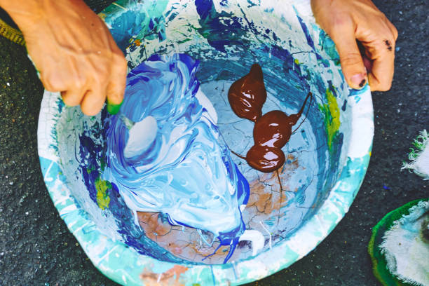 istock Painter craftsman artist mixes paints in a tray 2178014701