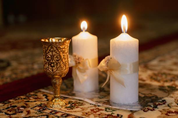 istock Gold goblet and candles on ornate carpet 2178015201
