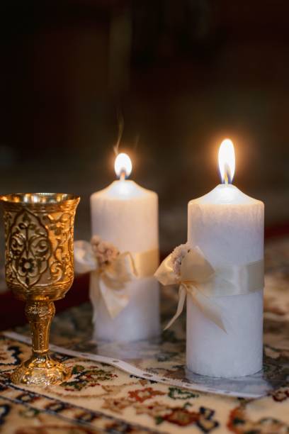 istock Elegant candles and goblet on ornate carpet. 2178015210