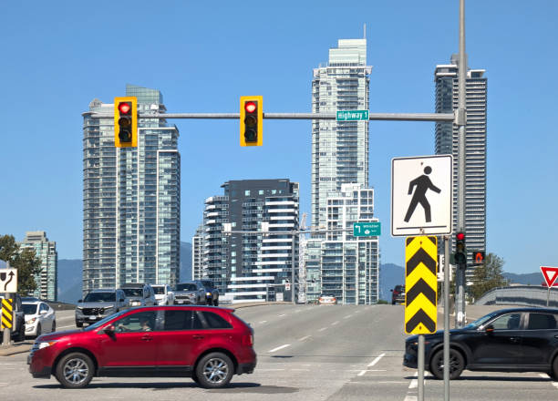 Burnaby, Canada - August 31, 2024: Looking north on the overpass on Willingdon Avenue from the Trans-Canada Highway or Highway 1. Tall residential towers line the Lougheed Highway area. Summer afternoon in Metro Vancouver.