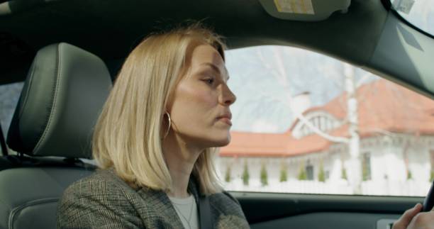 istock A woman is driving a car 2178019069