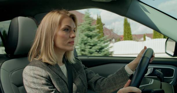 istock A woman is driving a car 2178019936