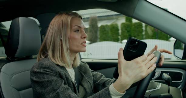istock A woman is driving a car 2178020676