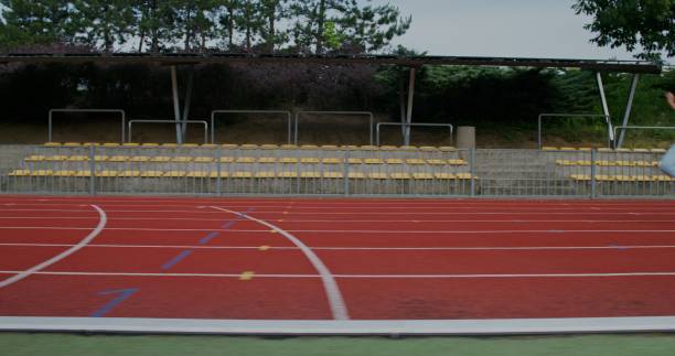 istock A woman runs in the stadium 2178021095