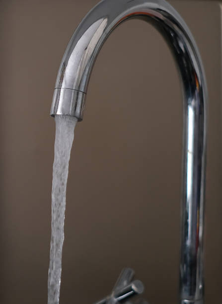istock water flowing from the tap 2178022334