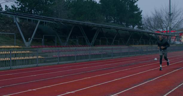 istock A man is running in the stadium 2178022630