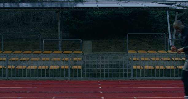 A man is running in the stadium