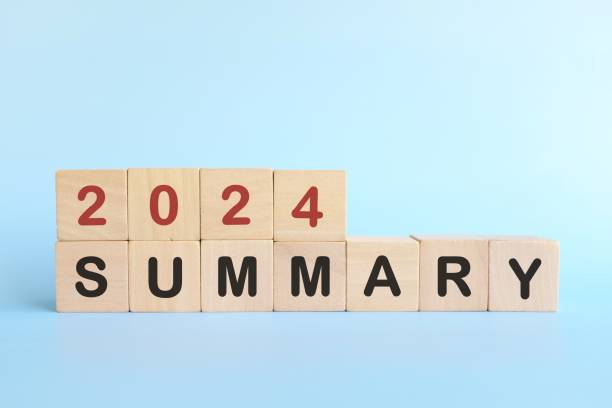 istock Year end 2024 summary concept. Wooden blocks typography in blue background. 2178024405