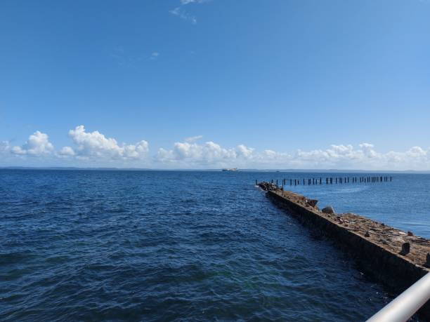 istock Serene ocean view with a stone pier 2178025204