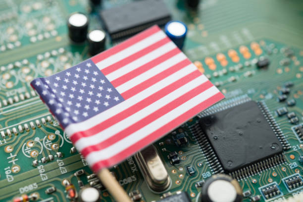 istock US American flag on green circuit board background. 2178026431