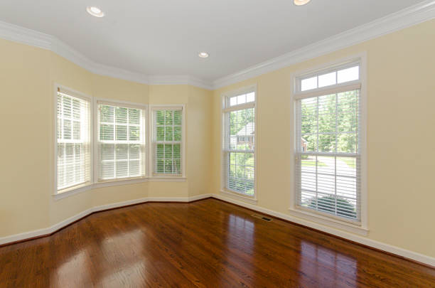 istock Spacious Sunlit Room With Wooden Floor And Windows 2178028827