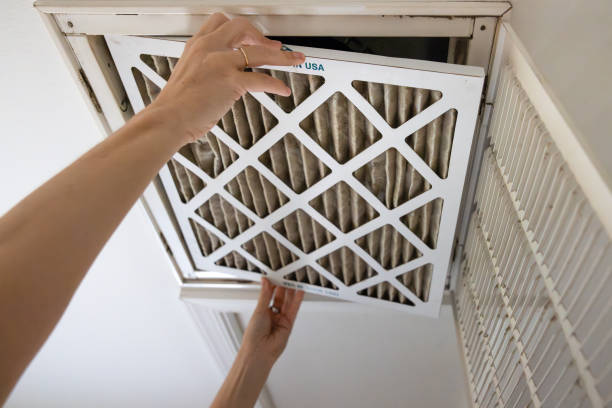 istock Homeowner Replacing Dirty HVAC Air Filter 2178030873