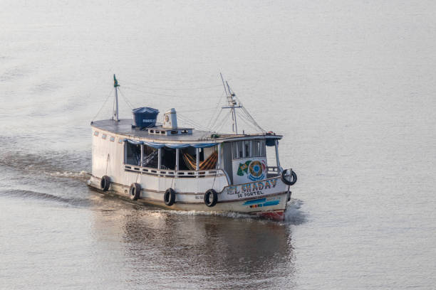 Breves, Para, Brasil - Sep 09, 2024: Traditional Amazonian wooden boat for passenger transport navigating a river in the Marajo Archipelago