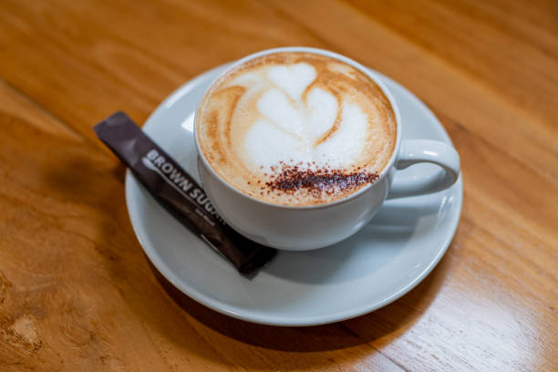 istock Cappuccino with Heart Latte Art on Wooden Table 2178039141