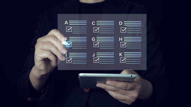 istock businessman Take an assessment, questionnaire, evaluation, online survey online exam Choosing the right answer in the exam, filling out an online survey form. Answer the test questions. 2178044355