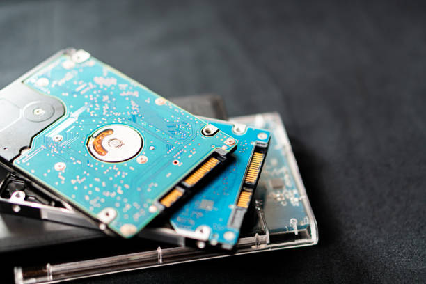 istock Close-up of Stacked Hard Drives on Dark Surface 2178049679
