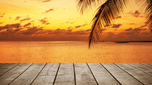 istock Empty wooden table top with tropical ocean sunrise background 2178051752