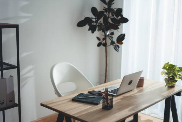 istock Wooden desk with laptop and office supply modern interior. 2178053235
