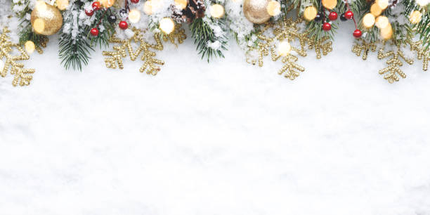 istock Christmas decorations scattered throughout the snow on a white background 2178053639