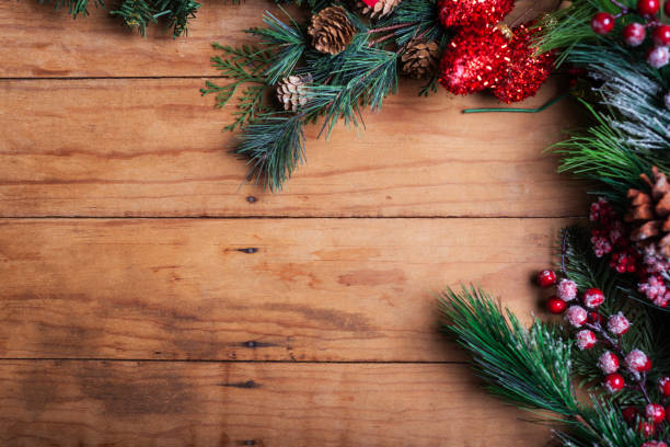 istock A close-up of a rustic wooden surface with Christmas greenery 2178055045