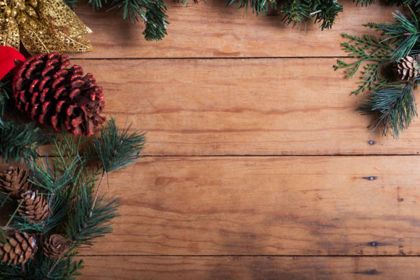 istock A close-up of a rustic wooden surface with Christmas greenery 2178055255
