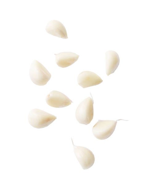 istock Close up of garlic cloves on white background 2178055800