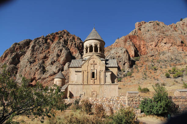 istock Ancient orthodox church building with a bell tower on a rocky mountainside 2178059145