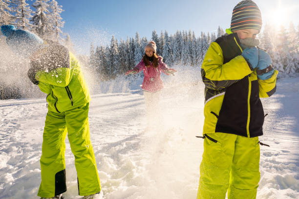 istock Children throw snowballs on the mountain 2178059732