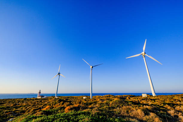istock Lighthouse View with Many Wind Turbines at Sunset in the Mediterranean 2178068781