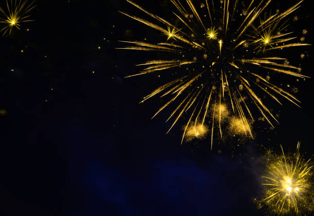 istock Golden fireworks burst in night sky 2178068972