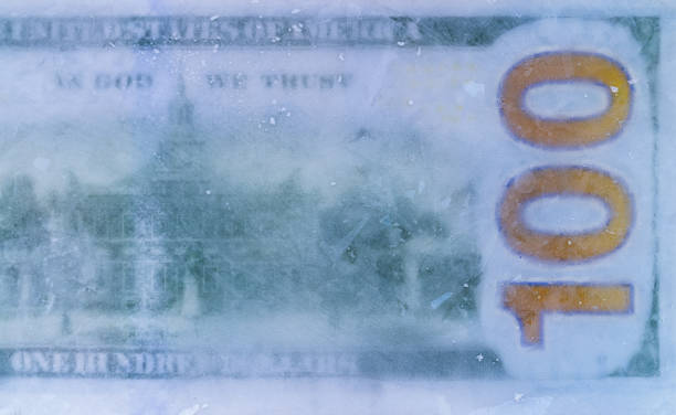 istock 100 US dollar frozen under a layer of ice 2178074104