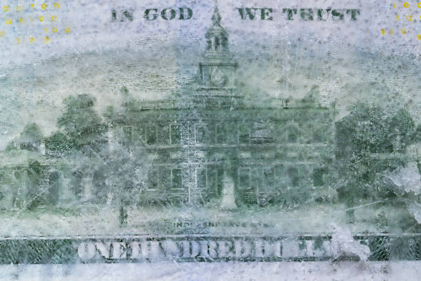 istock 100 US dollar frozen under a layer of ice 2178074112