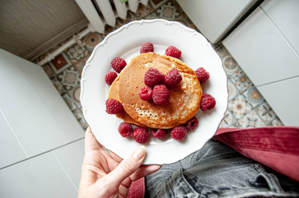 istock Delicious whole wheat healthy pancakes with raspberry, fork and knife styling natural light and copy space on the table with linen cloth background lifestyle 2178074680