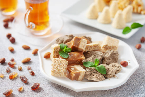 istock Oriental sweetness.  Nougat, halva and  tea on a table. 2178075218