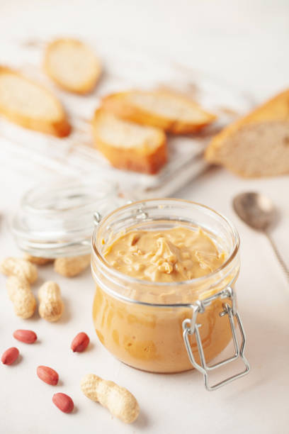 Empty Jar of Peanut Butter Cut Out on White.