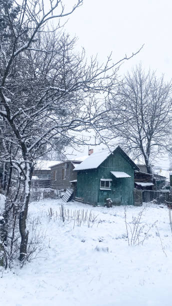 istock snow covered old small houses 2178075284