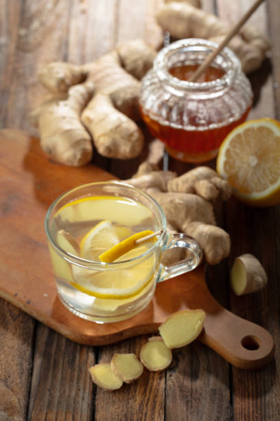 istock Ginger tea with lemon and honey on a old wooden table. 2178075717