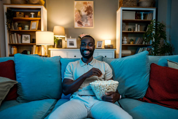 istock Man watching tv at home 2178076187
