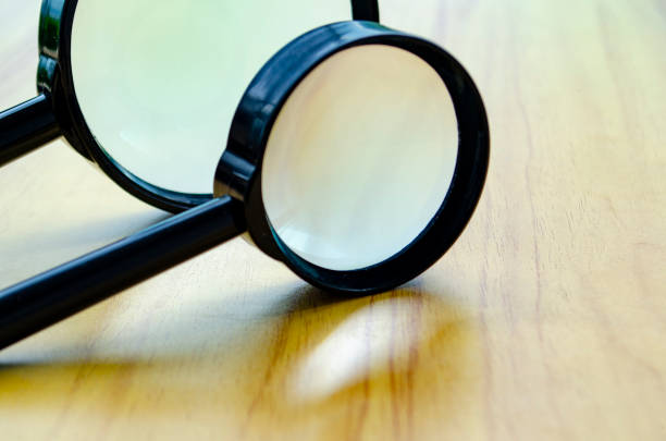 Close up of two magnifying glasses with customizable space for text or ideas.