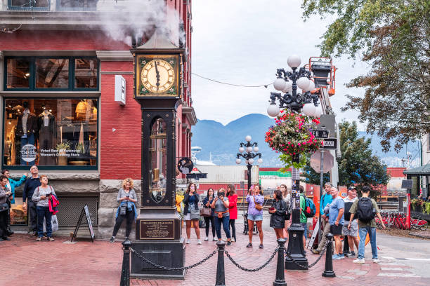 Vancouver, British Columbia, Canada  September 25, 2024: Tourists flock to the Gastown steam clock near downtown Vancouver, BC, Canada.