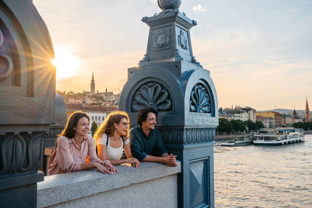 istock Three Friends Looking At View From The Chain Bridge In Budapest In Hungary 2178083024