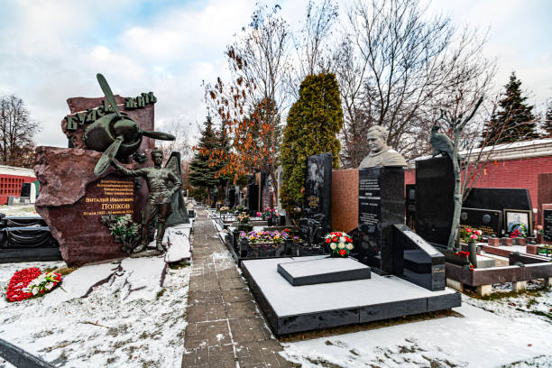 Moscow, Russia - November 26, 2018: This picture features the monument of Soviet fighter pilot Vitaly Popkov, located at Novodevichy Cemetery. Popkov's monument is positioned on the left side of the scene.