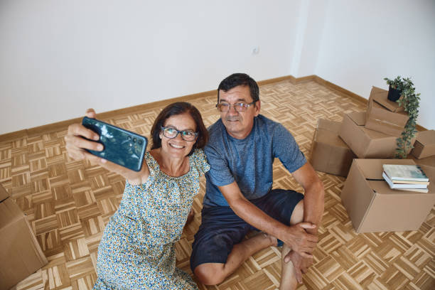 istock Senior couple moving into new home 2178092686