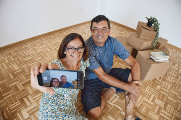 istock Senior couple moving into new home 2178093018