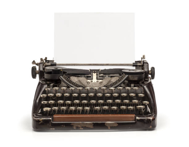Old vintage mechanical typewriter and a blank sheet of paper inserted. Isolated on the white background
