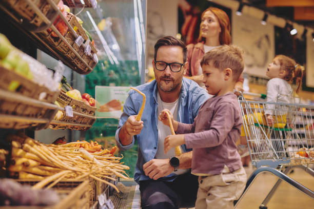 istock Father and Son Having Fun at the Grocery Store 2178096982